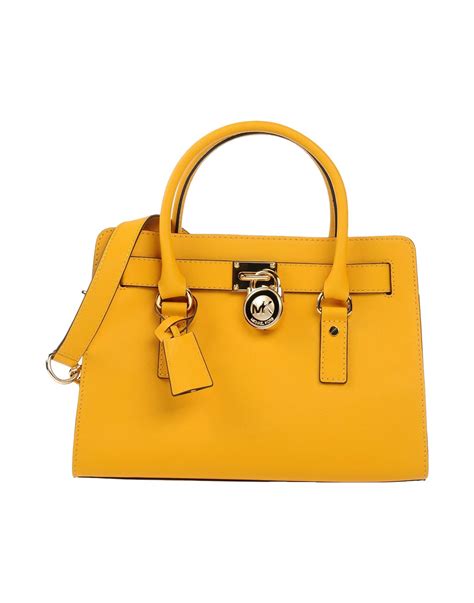 michael kors vintage yellow wallet|Michael Kors yellow shoulder bag.